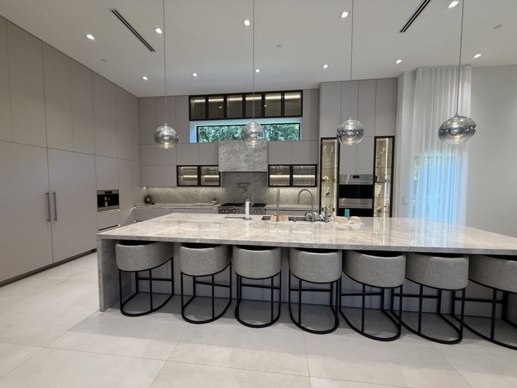 Modern kitchen island with glass-front cabinets