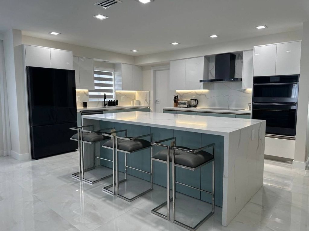 White kitchen with a sage green island