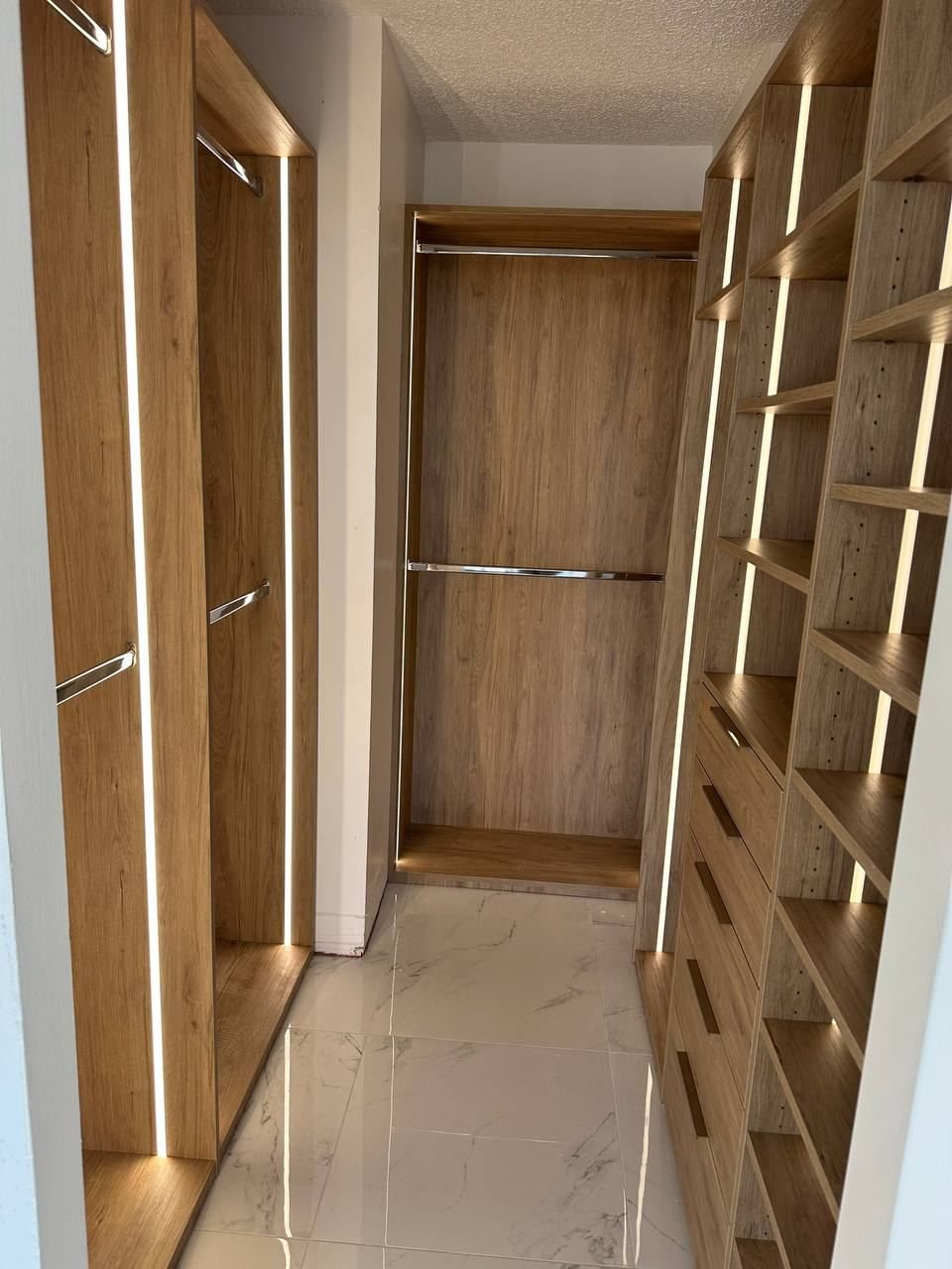 Oak walk-in closet with LED lighting