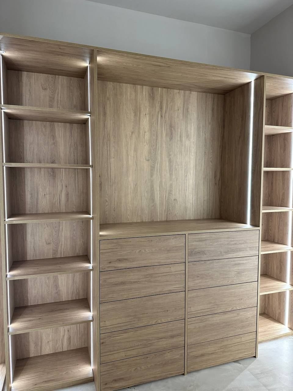 Closet wall unit with drawers and open shelving