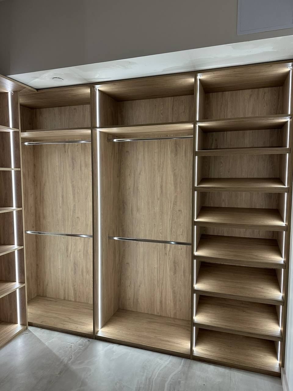 Oak closet shelving with LED strips