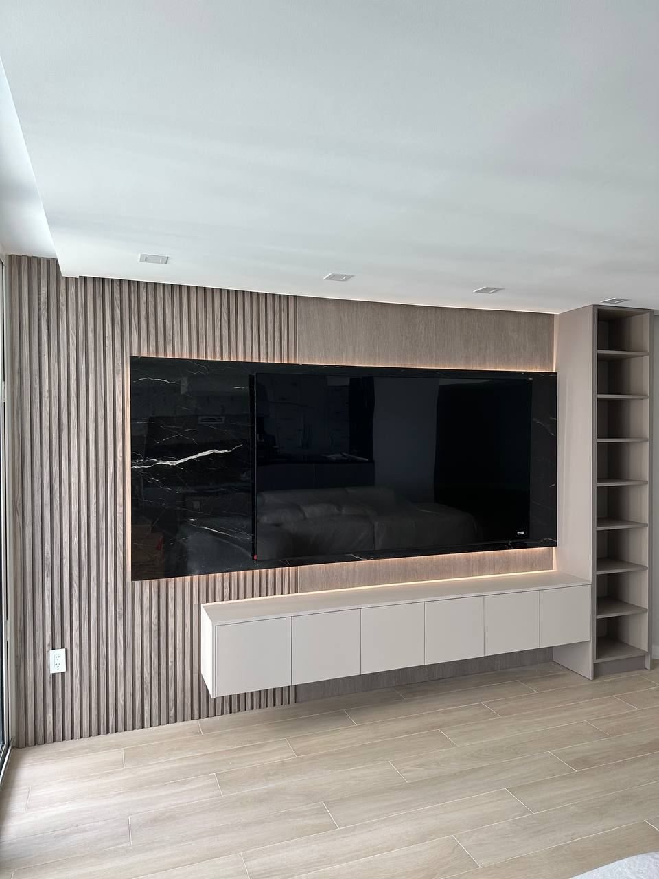 Media wall with wood slat panels